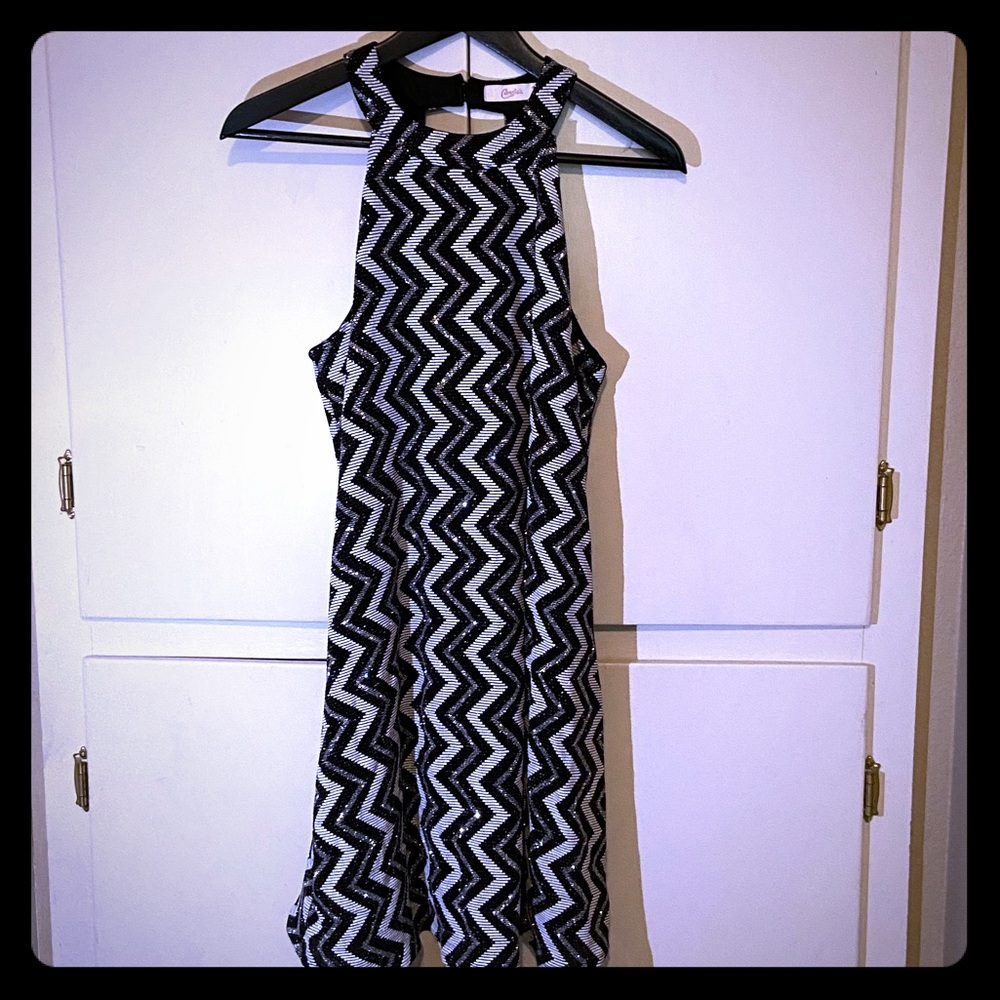 It is a dress, that is black and white.